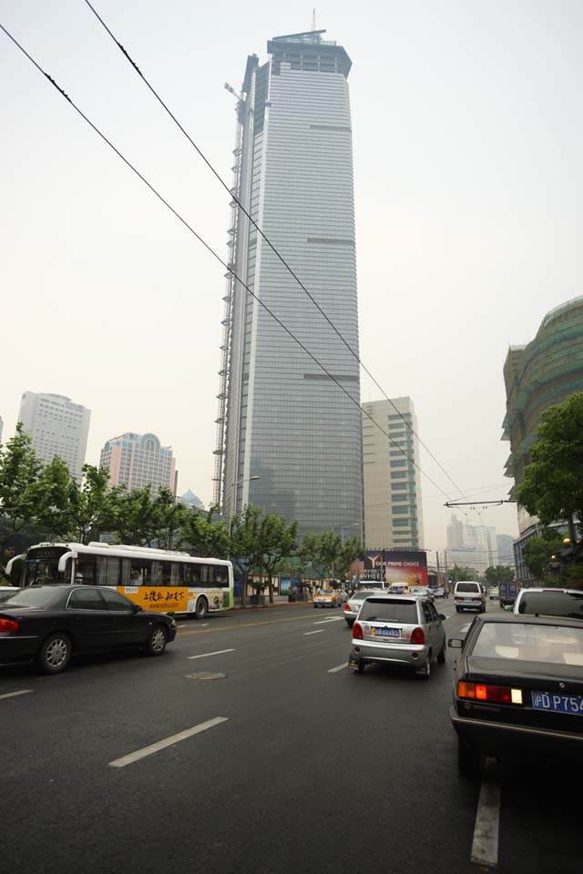 photo,material,free,landscape,picture,stock photo,Creative Commons,Row of houses along a city street of Shanghai, building, paved road, bus, car