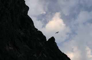 Foto, materiell, befreit, Landschaft, Bild, hat Foto auf Lager,Ein Drachen ber einer Klippe, Klippe, Drachen, Himmel, Wolke